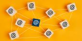 Email at symbol on wooden cubes linked each other with lines as network on yellow background. Email traffic or chain mail concept
Email at symbol on wooden cubes linked each other with lines. Email traffic or chain mail concept, Email at symbol on wooden cubes linked each other with lines. Em